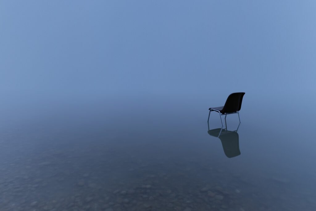 What is Narcissism? Often, it involves a deep sense of isolation and a fragile self-image, visually represented by this image of a solitary chair in a misty landscape.