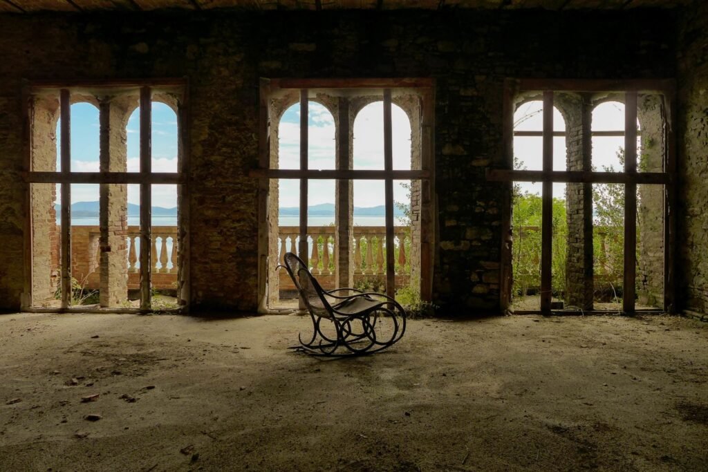 Narcissism and relationships - The lonely throne: A rocking chair in a decaying room symbolizes the isolation and emptiness at the heart of narcissism, a kingdom built on fleeting admiration and ultimately devoid of genuine connection.